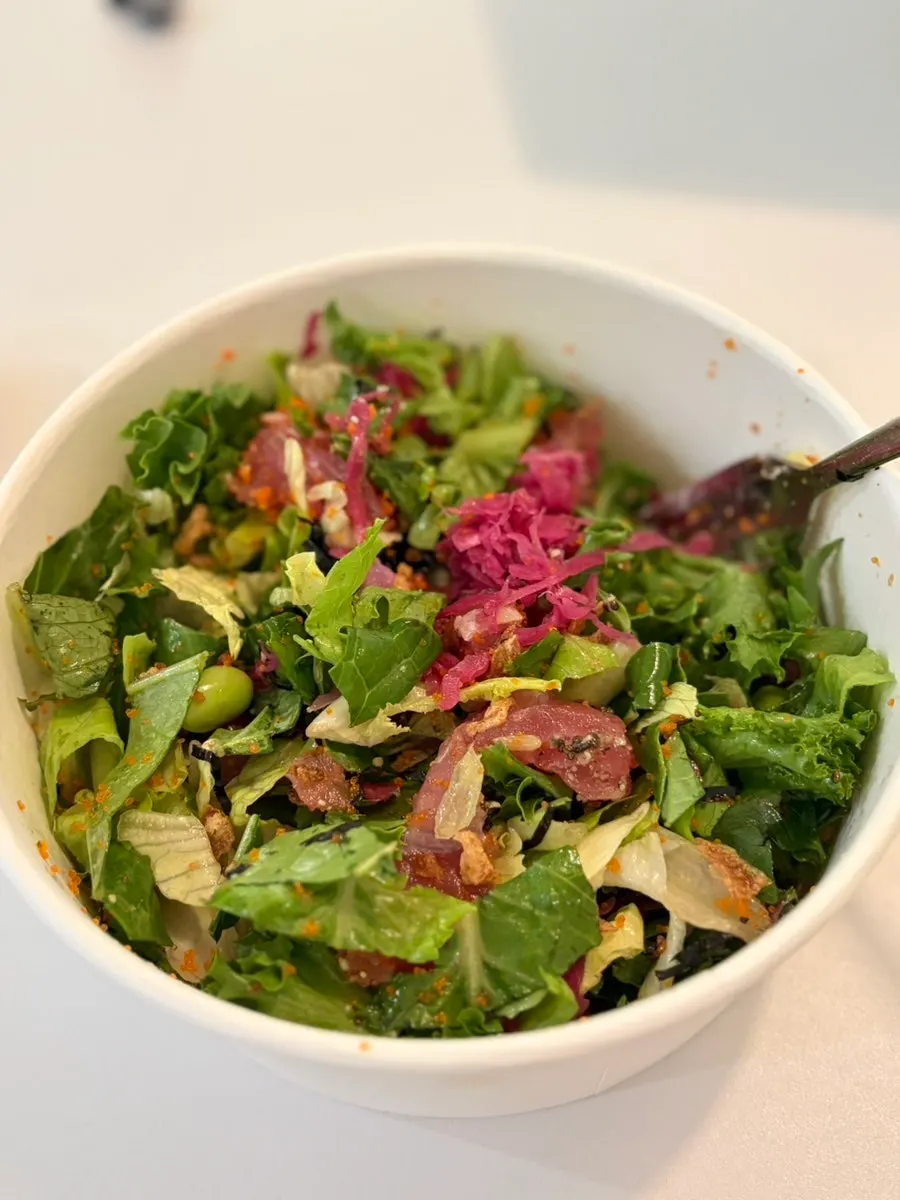 Close-up of tuna poke packed with vegetables