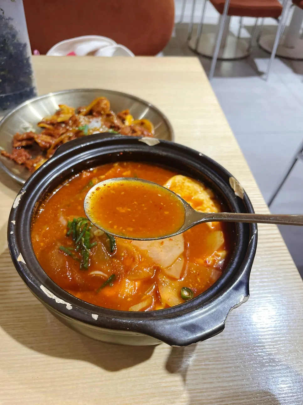 Stew served alongside sticky black rice