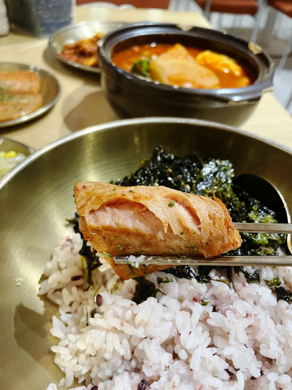 A meal of kimchi jjigae with grilled spam