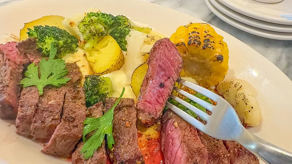 Dipping vegetables into the mashed potato