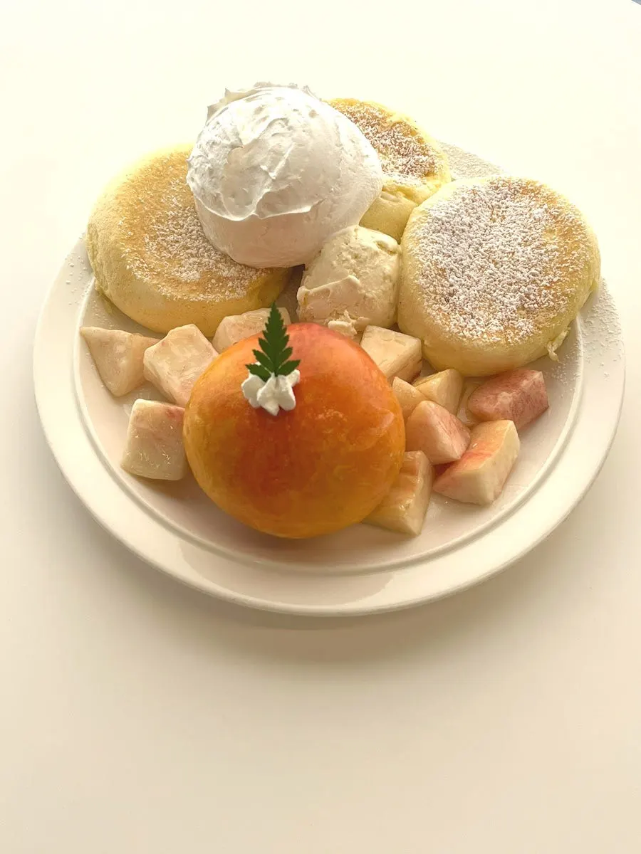 Three soufflé slices with whipped cream and Häagen-Dazs ice cream