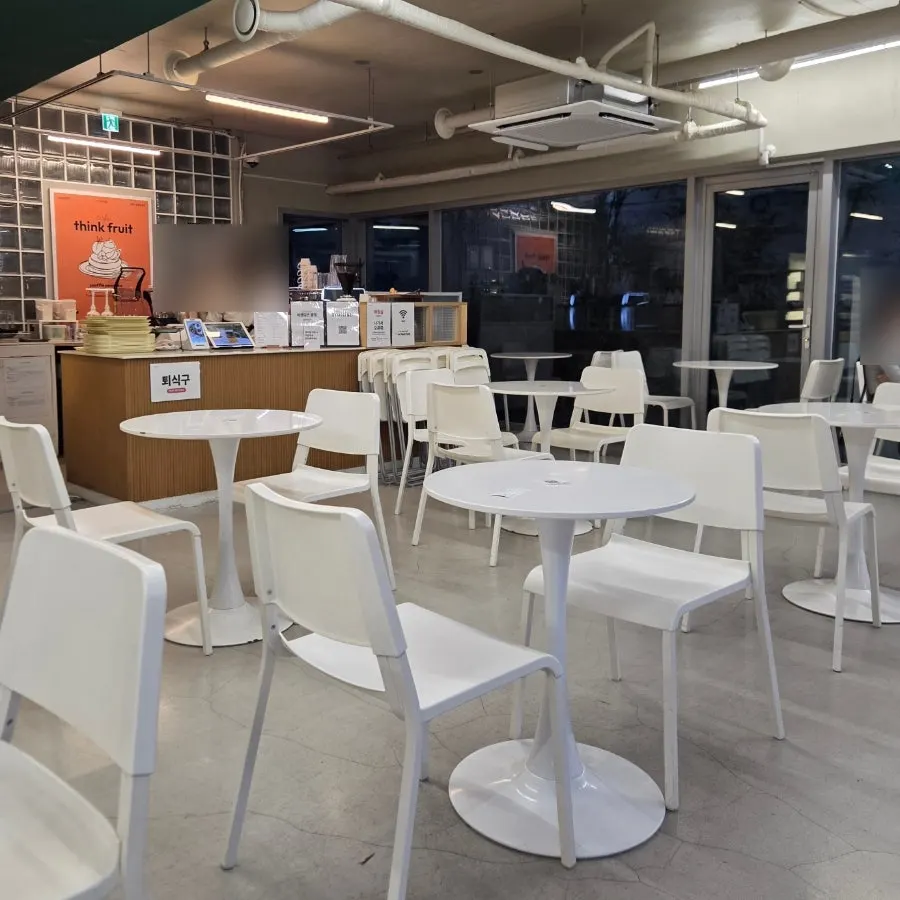 Bright, spacious interior and tables inside Think Fruit