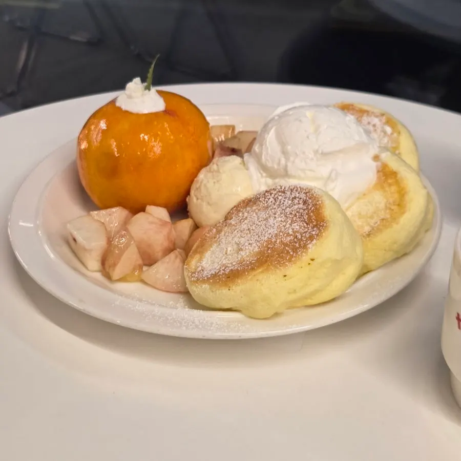 A plate of peach soufflé served at the table