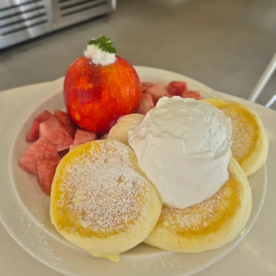 A soufflé generously topped with peach