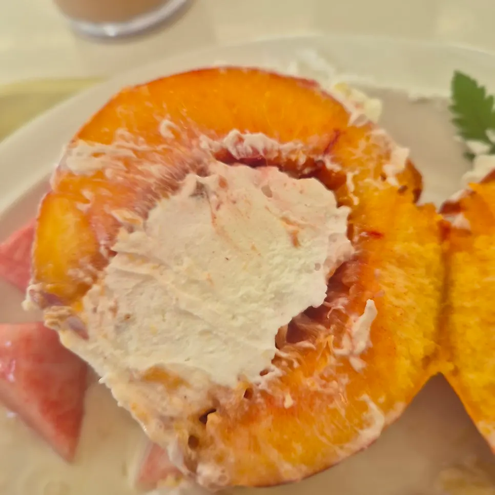 A bite of soufflé with peach and Greek yogurt
