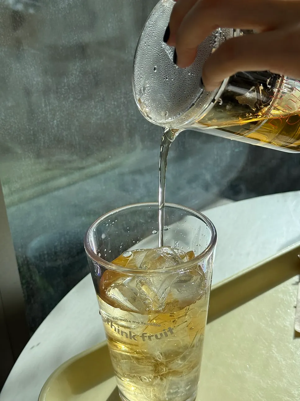 A cup of Think Fruit's peach oolong tea