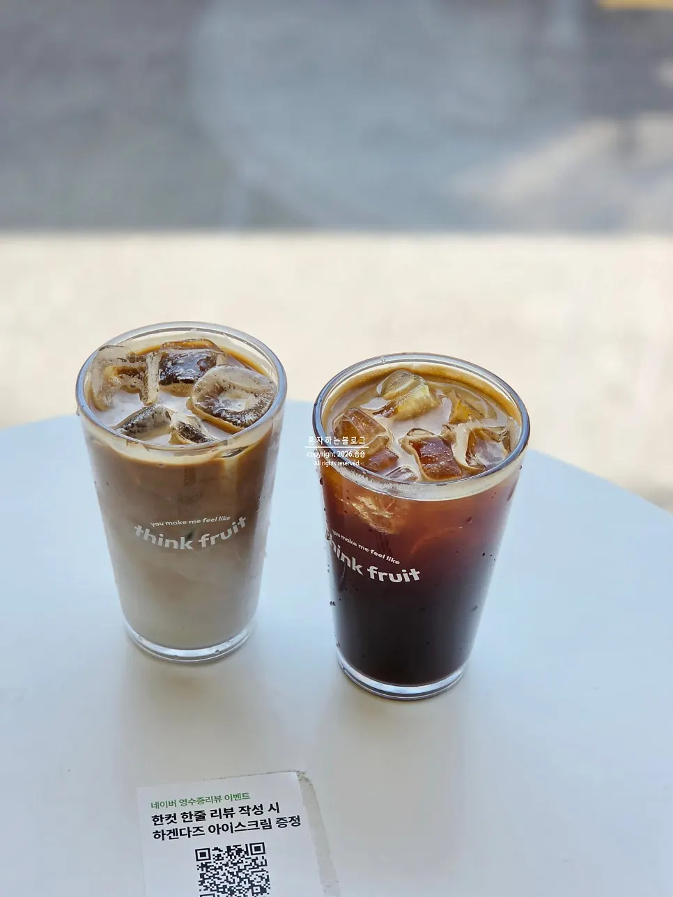 Two cups of Americano and caffè latte at Think Fruit
