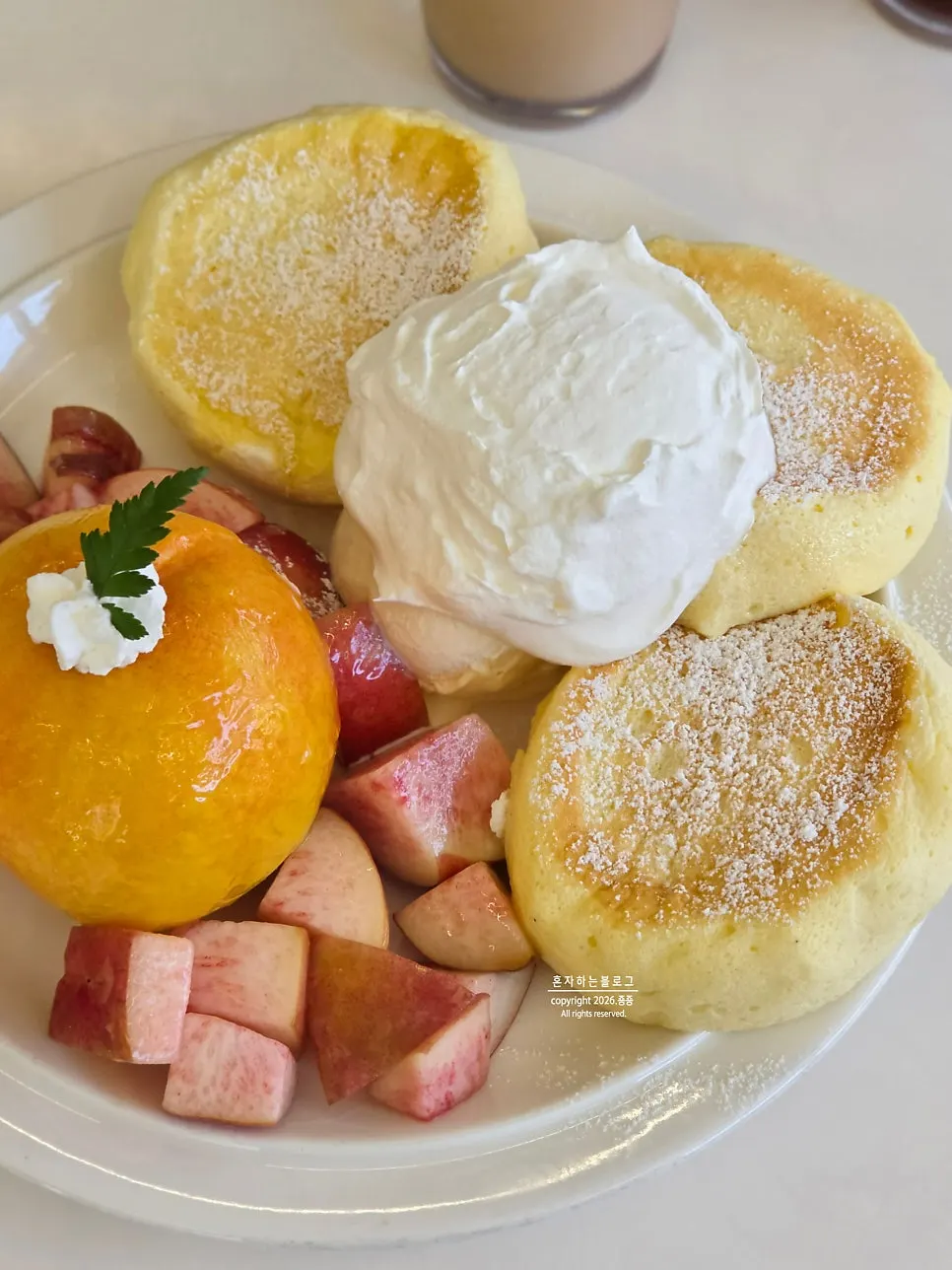 Fluffy soufflé sheet topped with peach
