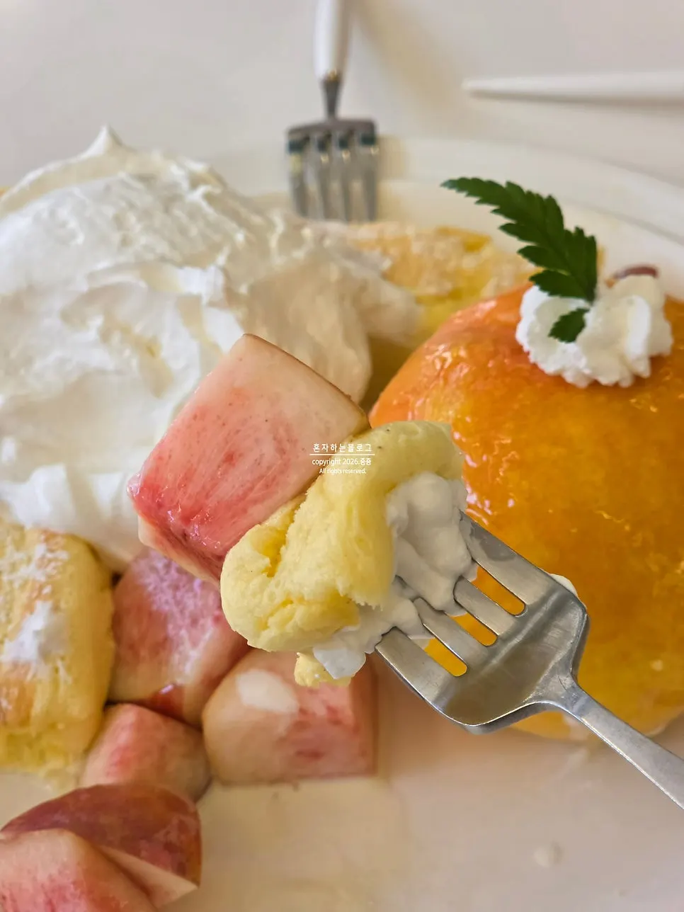 Fresh cream served alongside the soufflé