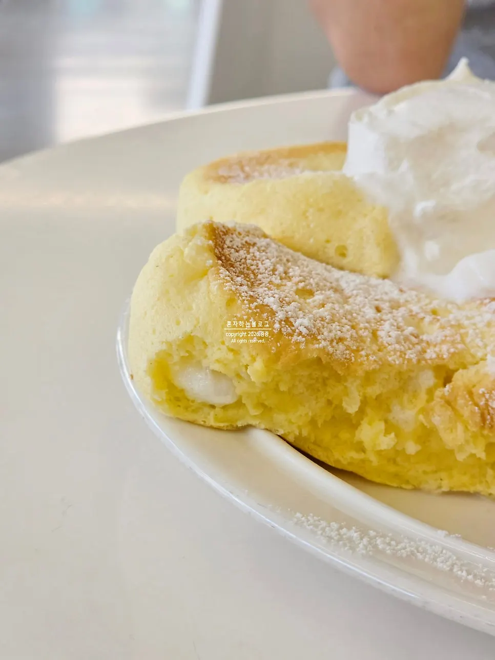 A forkful of crisp peach and soufflé sheet