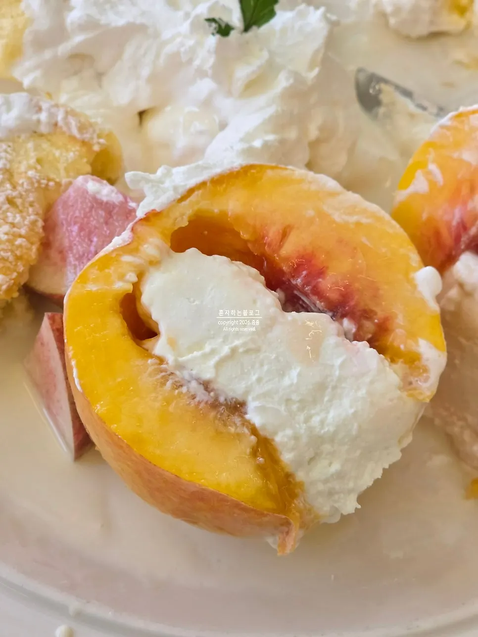 Cross-section of juicy peach with cream cheese inside