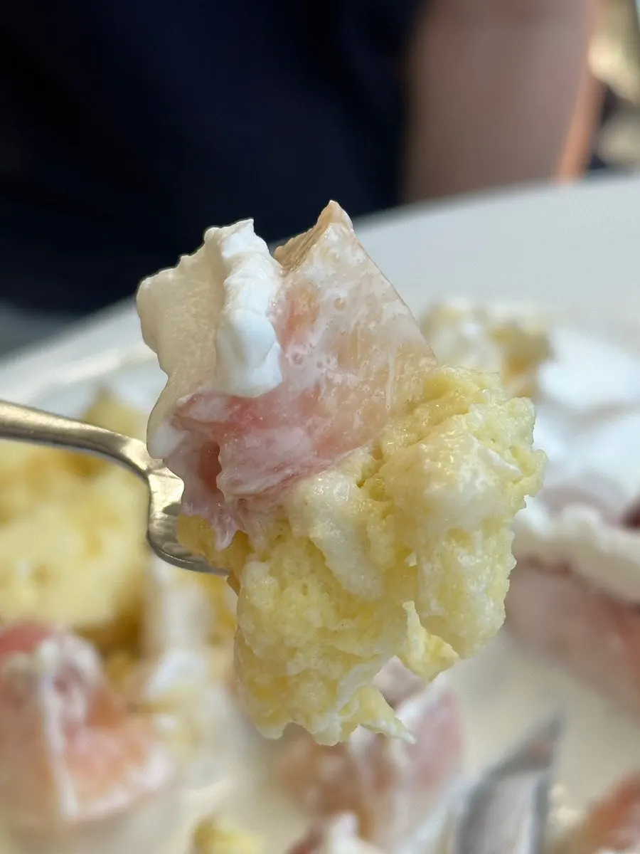 Soufflé served with whipped cream and vanilla ice cream