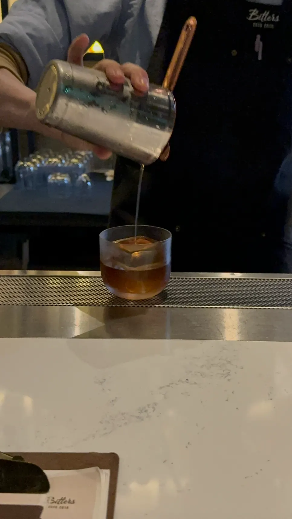 Amber-colored Godfather cocktail with ice
