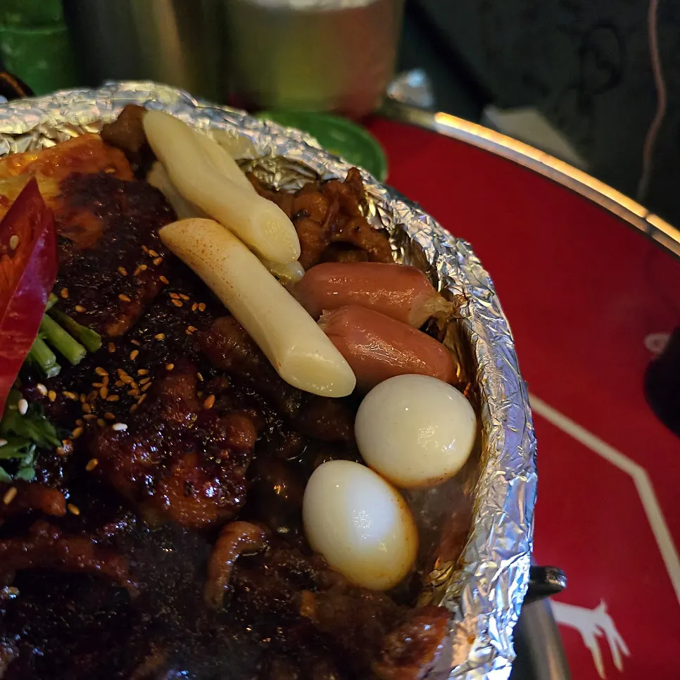 Spice level 1 soup chicken feet boiling on the table burner