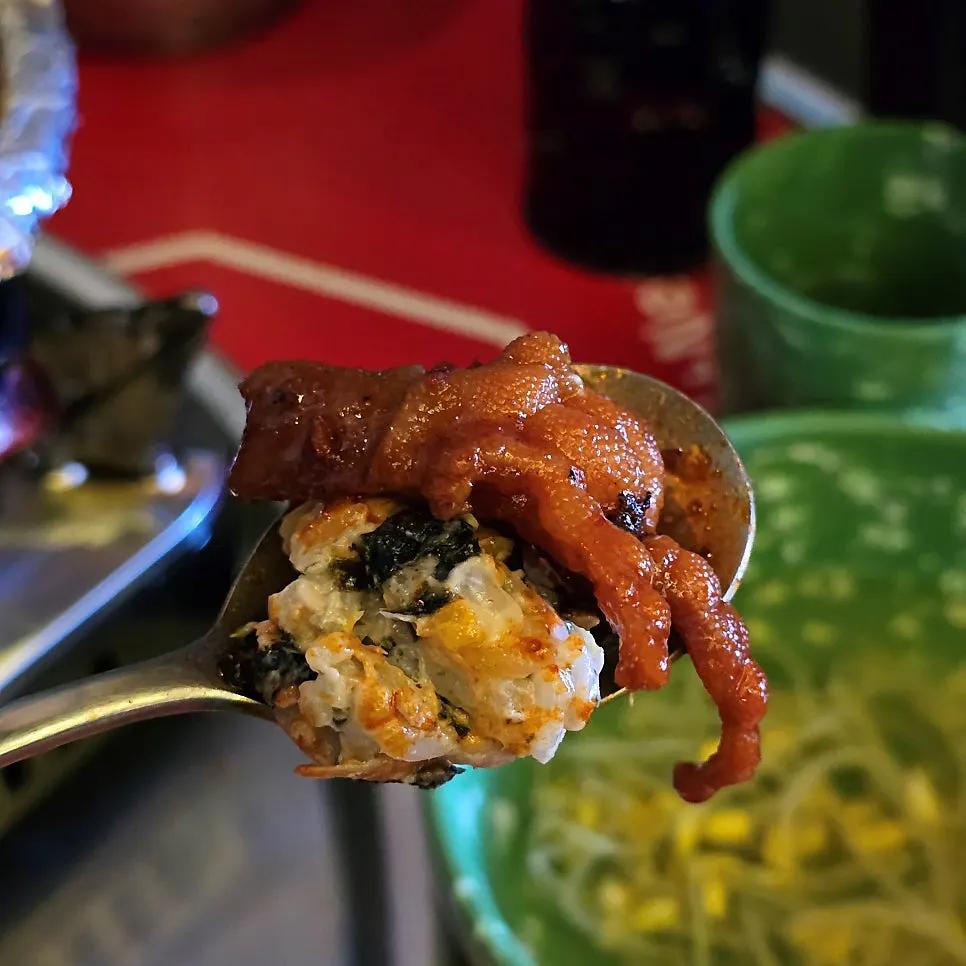A bite of kalguksu mixed with chicken feet broth