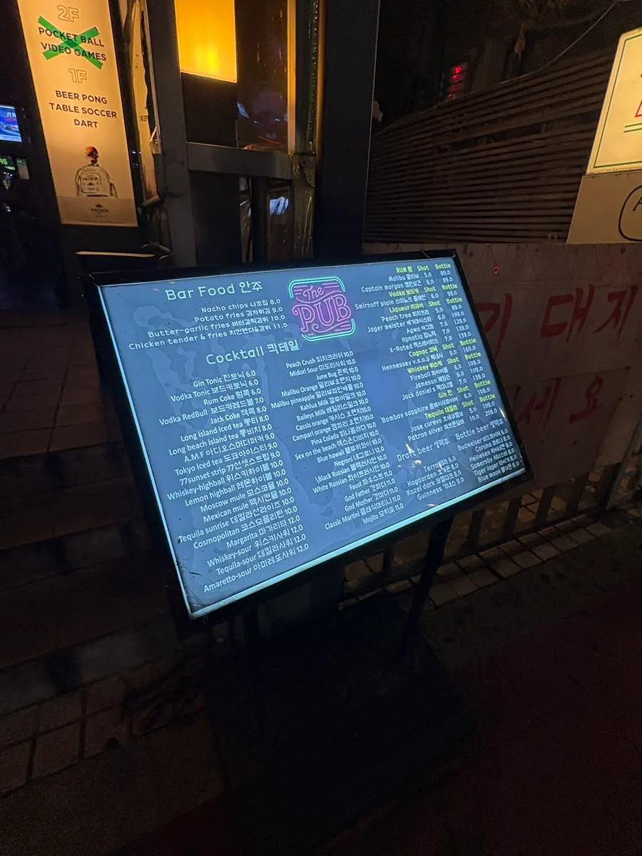 Drinks menu displayed outside The Pub Sports Pub Hongdae