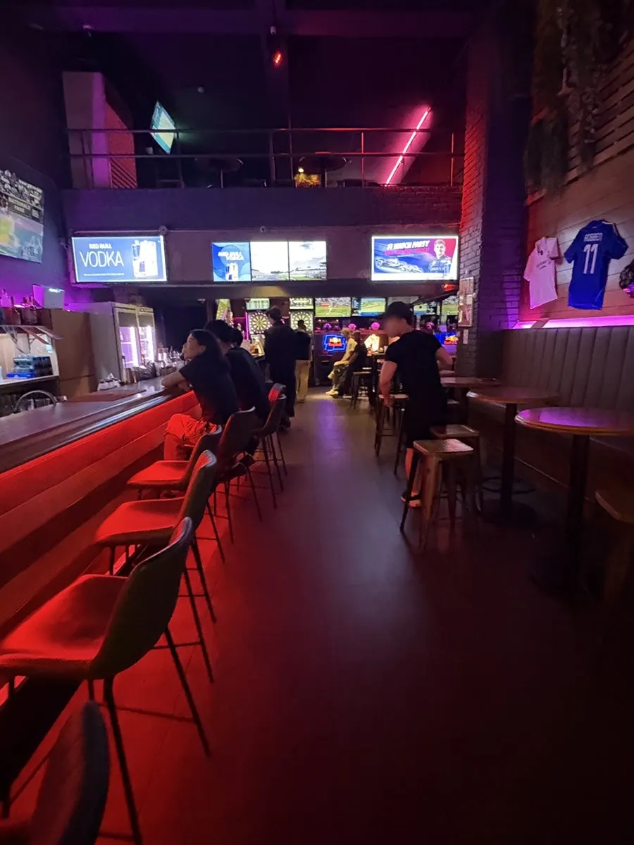 Interior of The Pub Sports Pub Hongdae's hall with screens visible