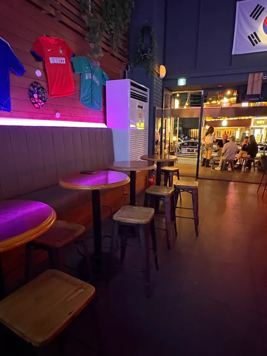 Neatly arranged tables and lighting in the sports pub