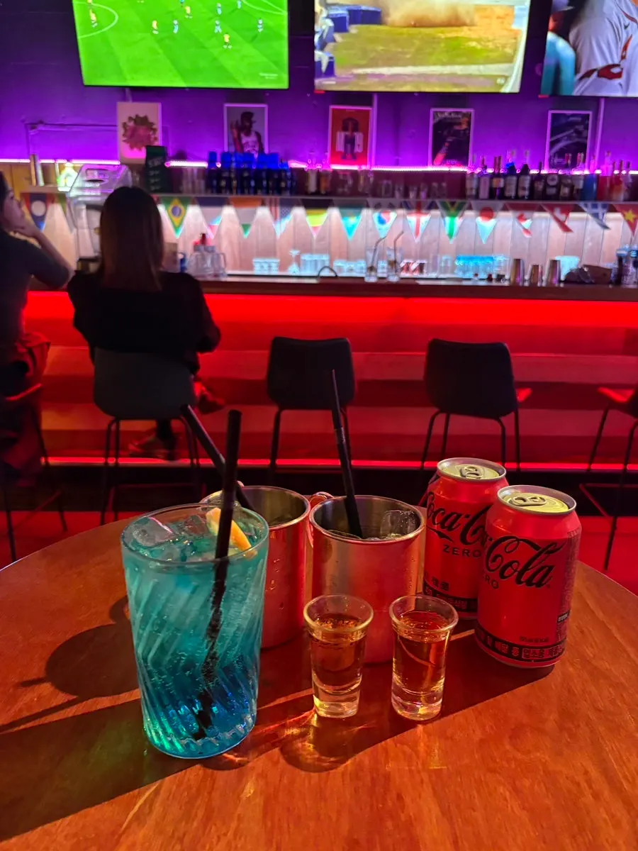 Bar counter set up with cocktails and draft beer