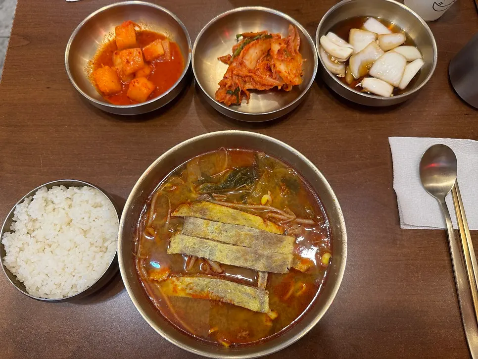 Spicy yukjeon gukbap topped with beef pancake