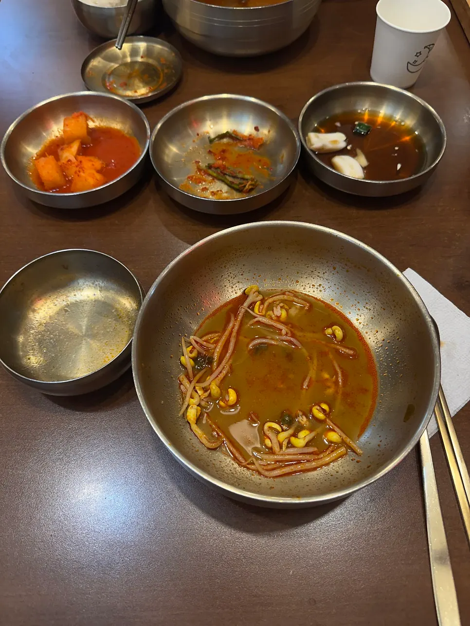 A stone bowl of yukjeon gukbap nearly finished