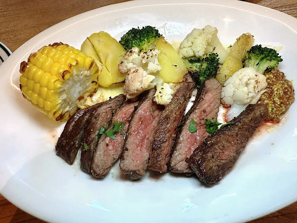 Plate of MELA's chuck tender steak with avocado added