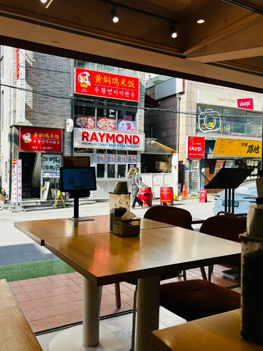 Full window wall bringing natural light into Bap Jangin Hongdae Branch