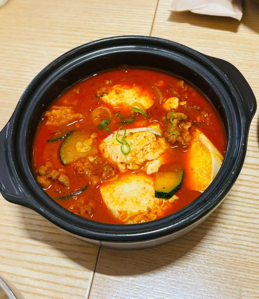 Ttukbaegi of spicy sundubu-jjigae with brisket
