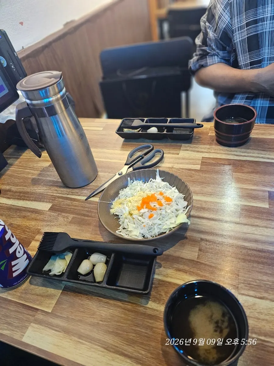 Yu Iksang Sushi menu board listing the Couple A Plus for ₩56,000
