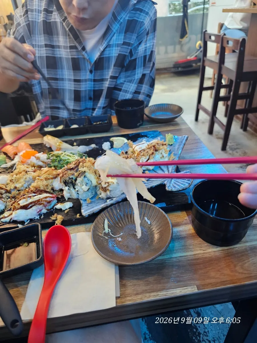 Torched aburi sushi including tamago aburi and garlic shrimp aburi