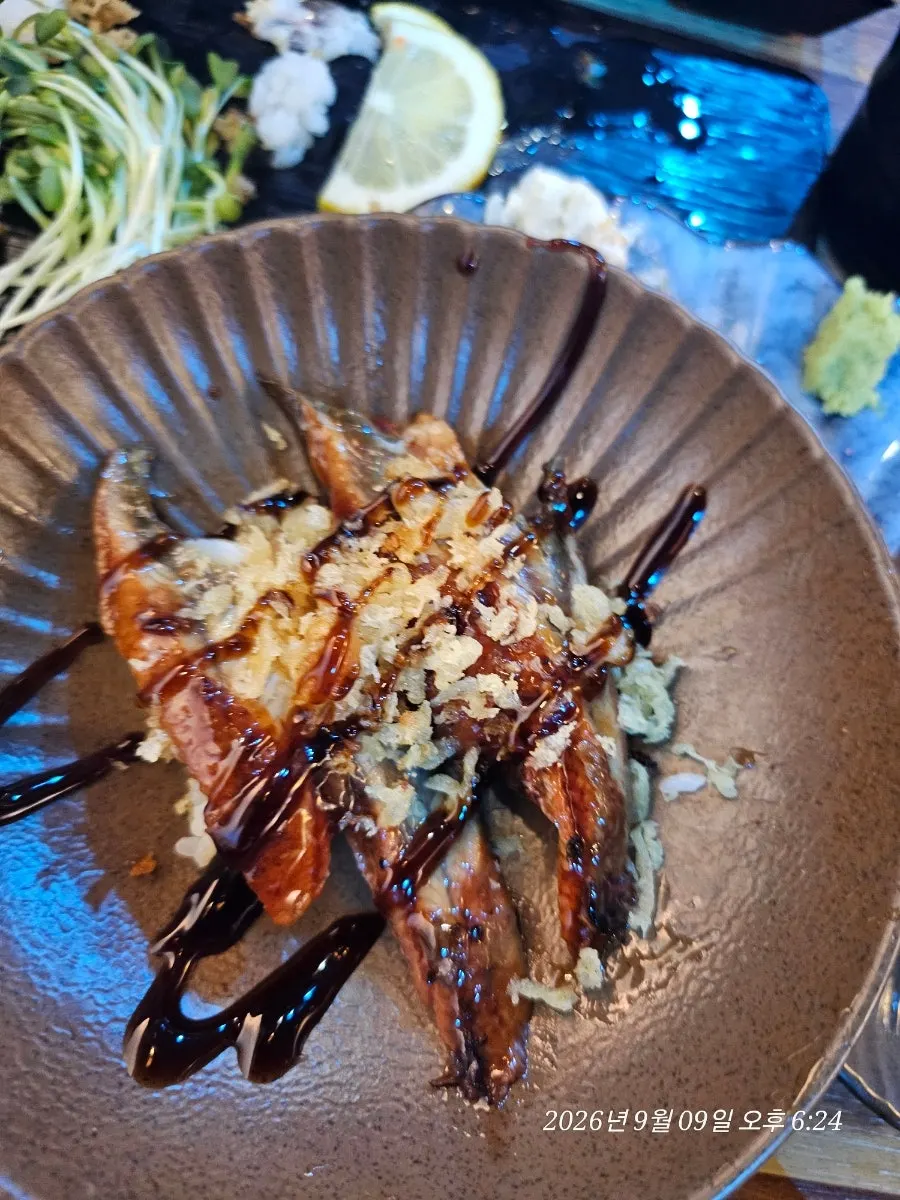 Dining at a table inside the small Yu Iksang Sushi space