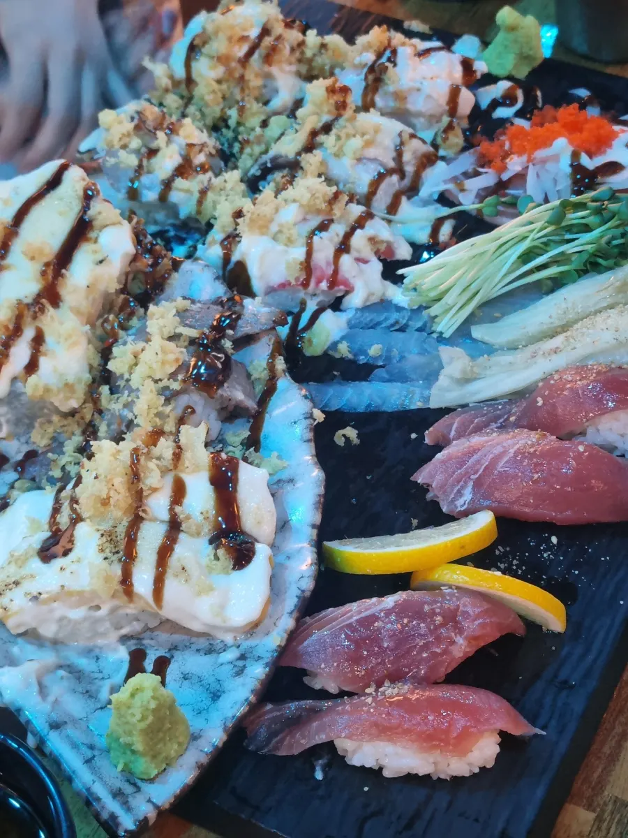 Fusion sushi topped with sauce