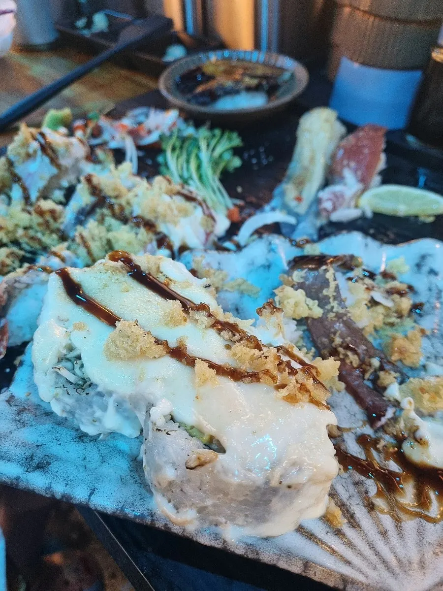 Long-tail sushi under dim lighting