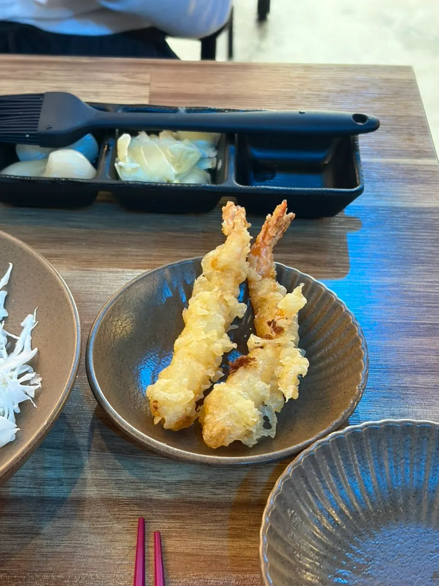 A spread of side dishes at Yu Iksang Sushi