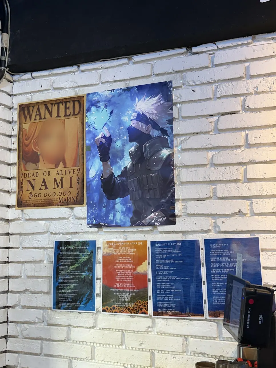 Anime posters on the restaurant wall