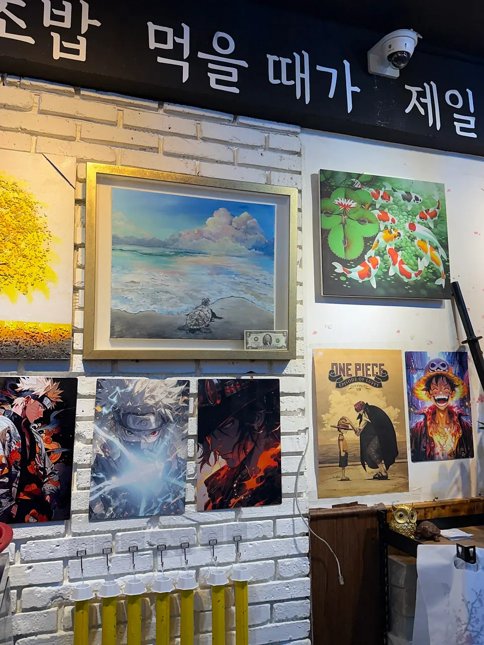 Walls covered with posters throughout the restaurant