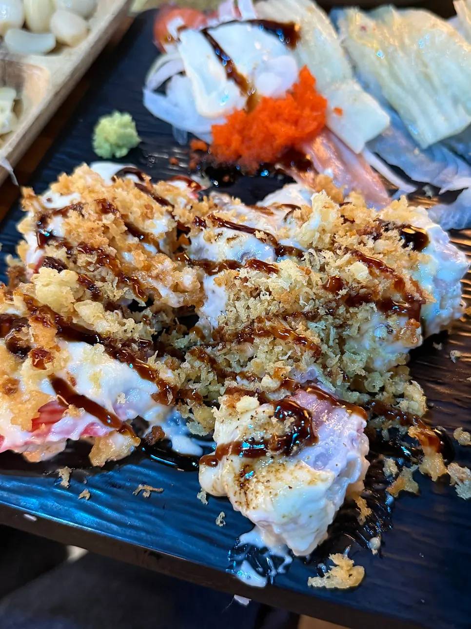 26 pieces of fish sushi and torched sushi arranged together