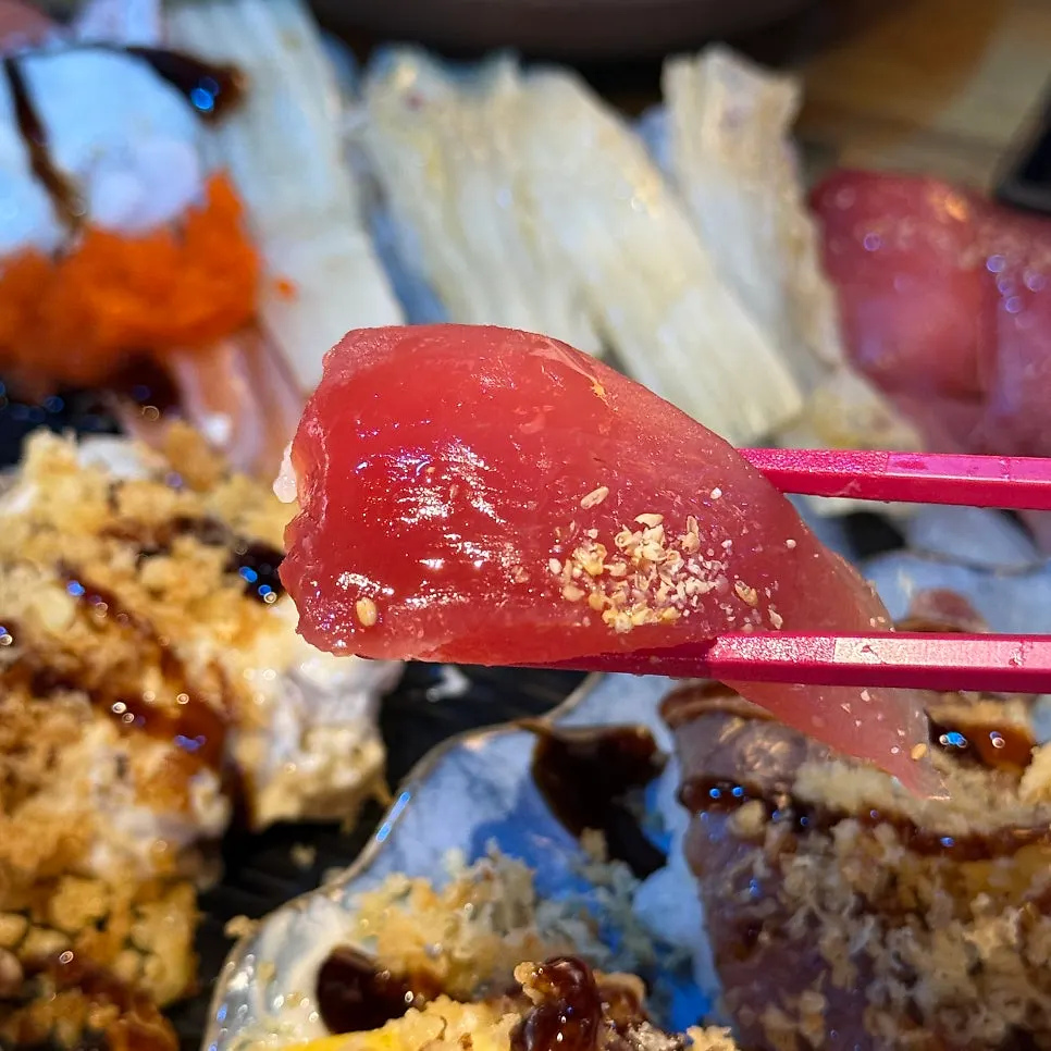 Tuna sushi brushed with soy sauce