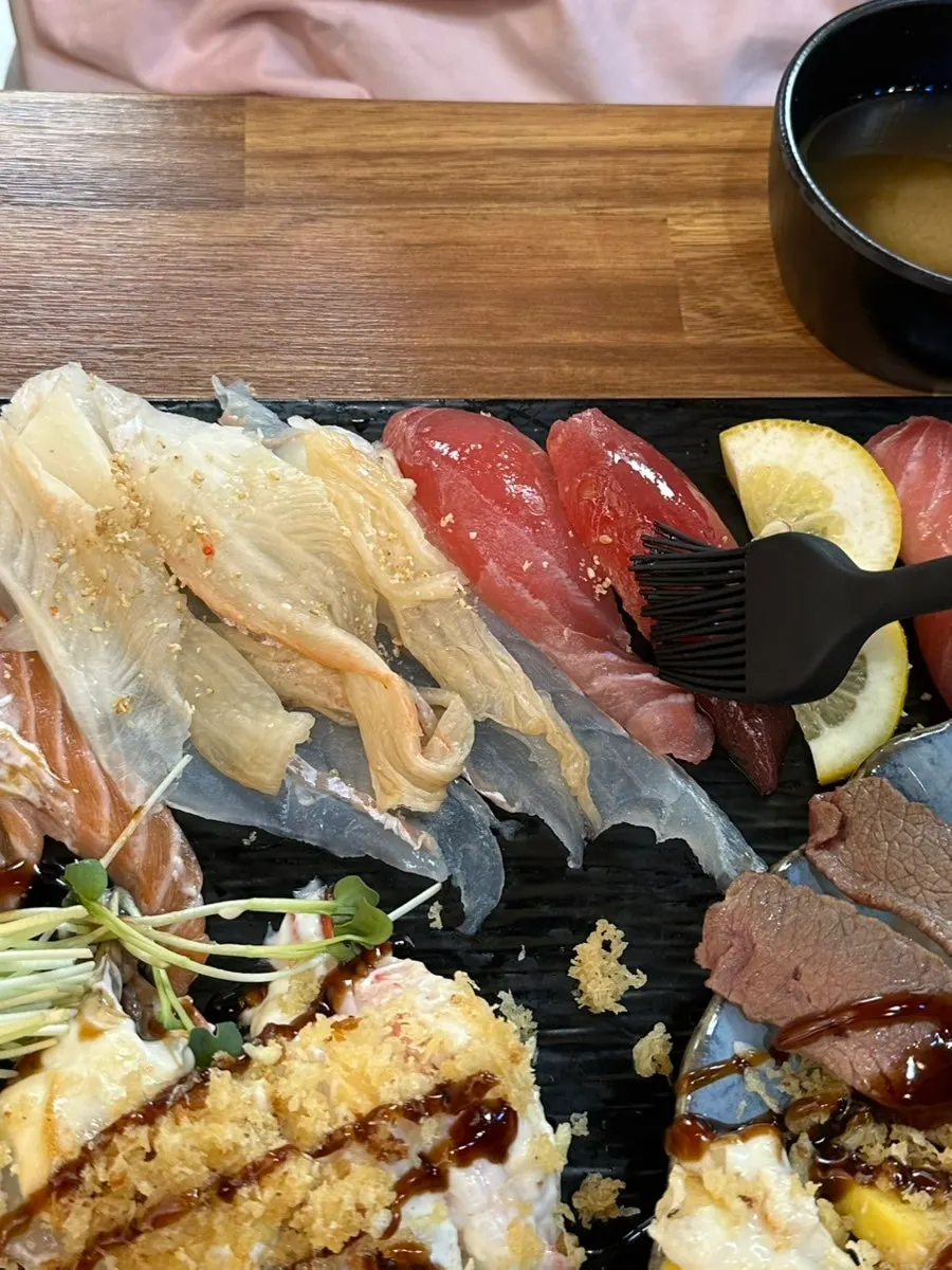 A piece of long-tail sushi where the fish outlasts the rice