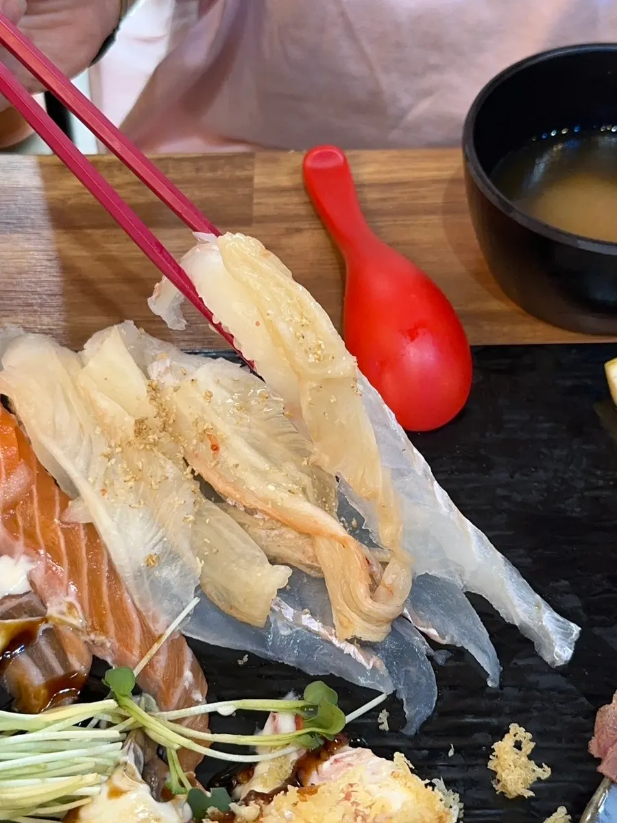 Close-up of the long, trailing tail of the sushi
