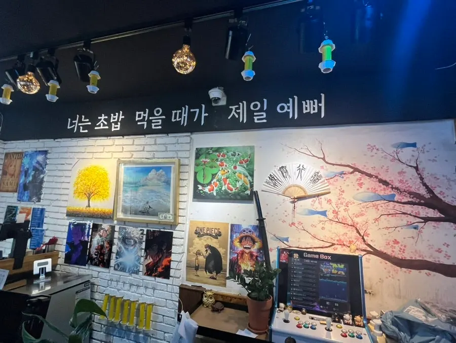 Interior of Yu Iksang Sushi with counter and table seating
