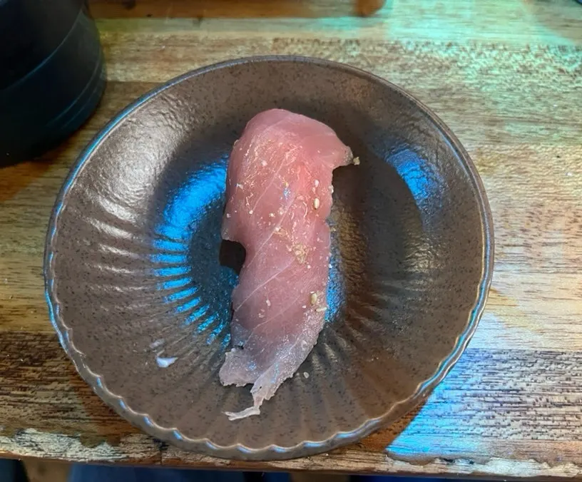 Tuna sushi with soy sauce brushed on