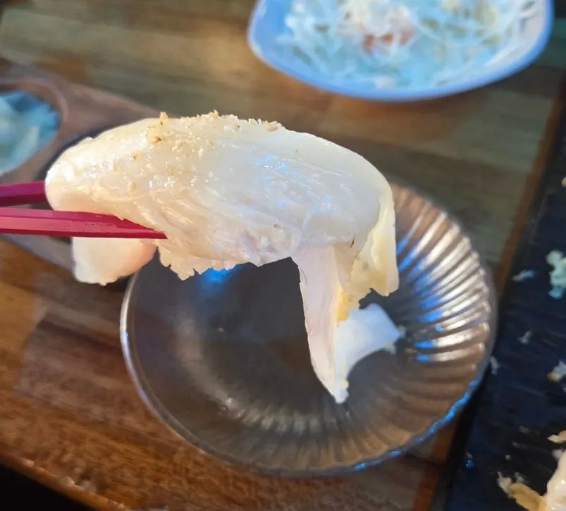 Extra-long-tail flounder sushi topped with baek-kimchi