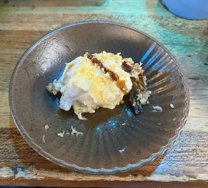 Shrimp sushi topped with sauce
