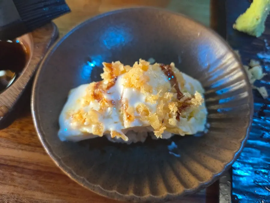 A piece of beef sushi