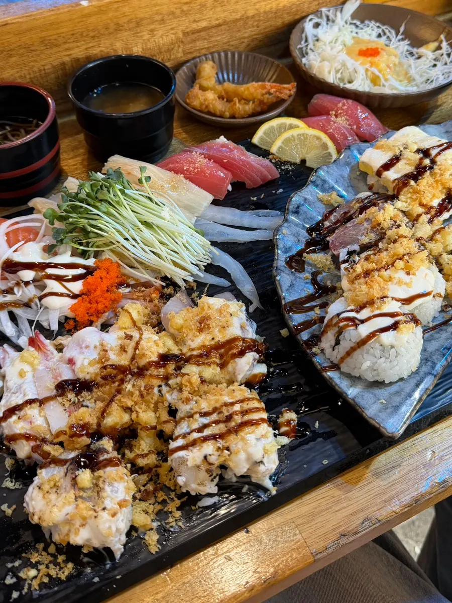 Sushi with a full spread of basic sides