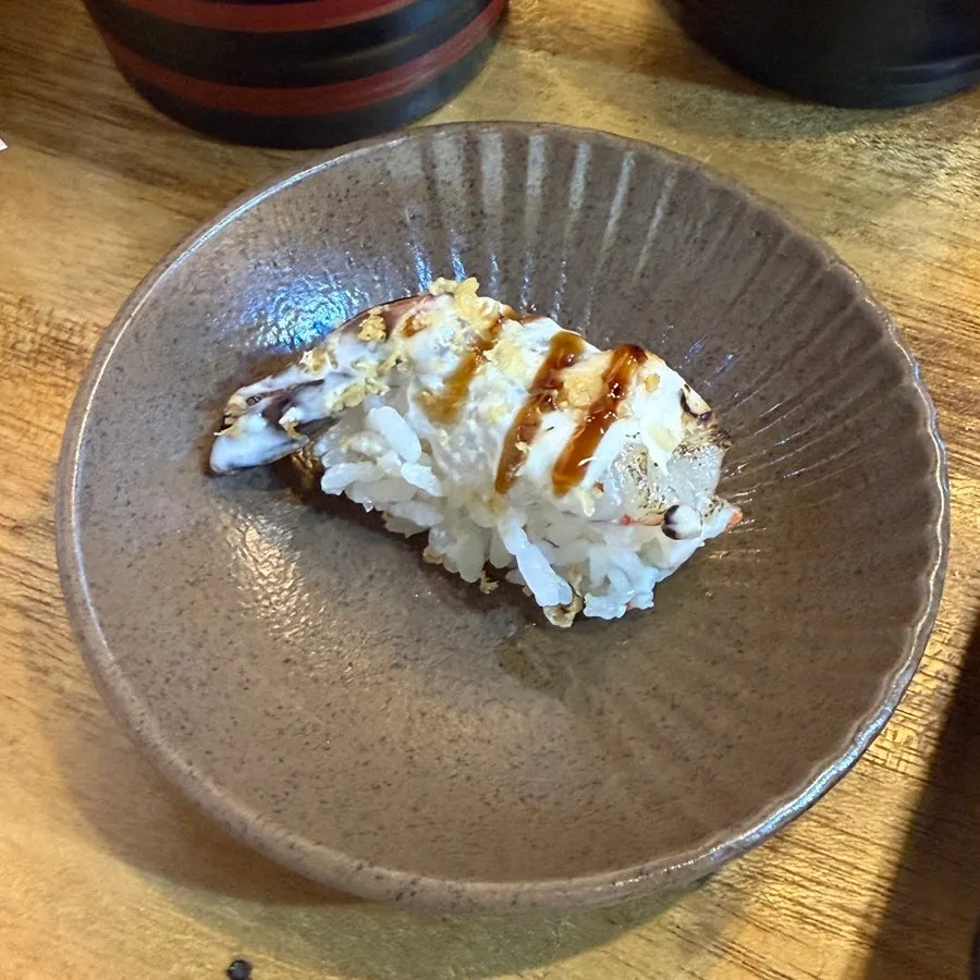 Long sushi eaten with a spoon