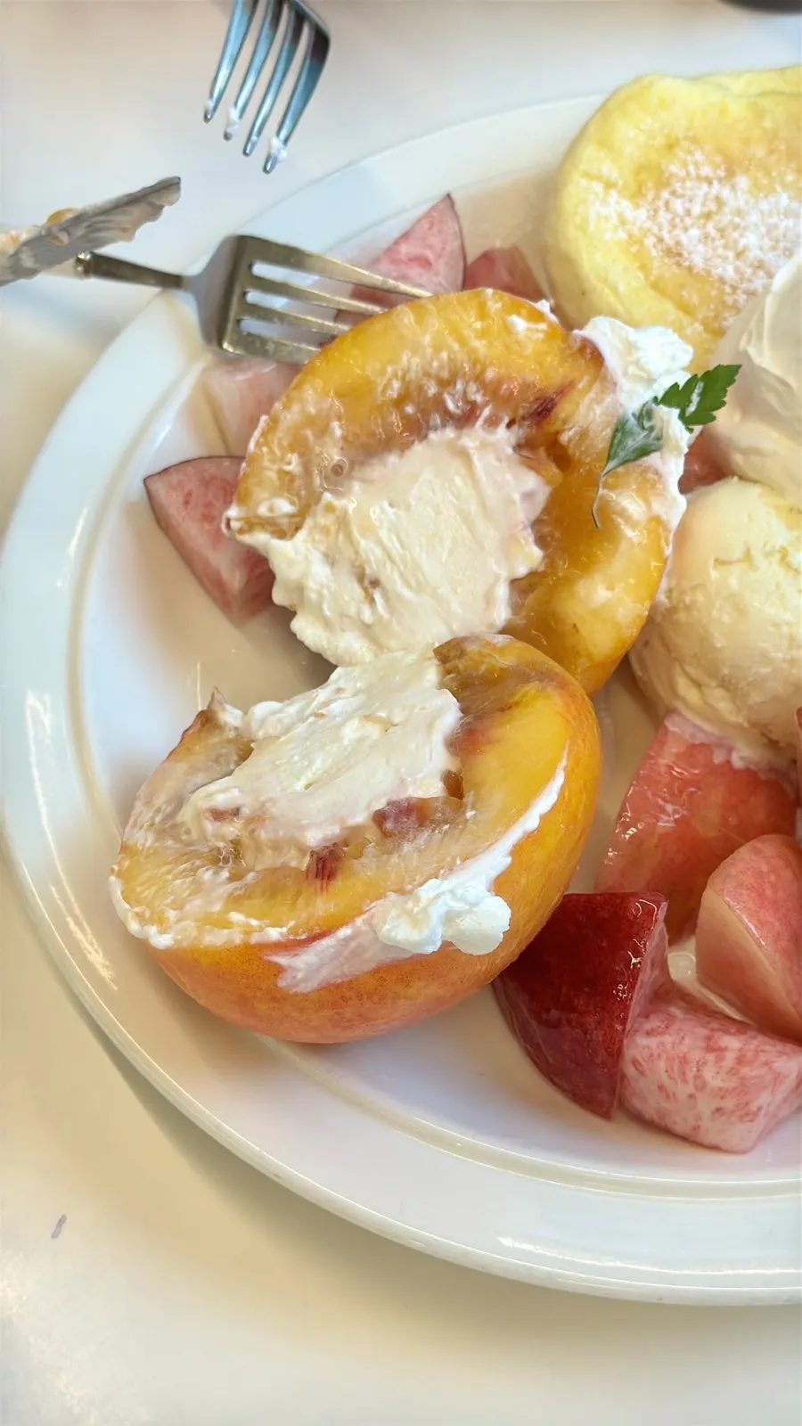 Soft yellow peach filled with Greek yogurt