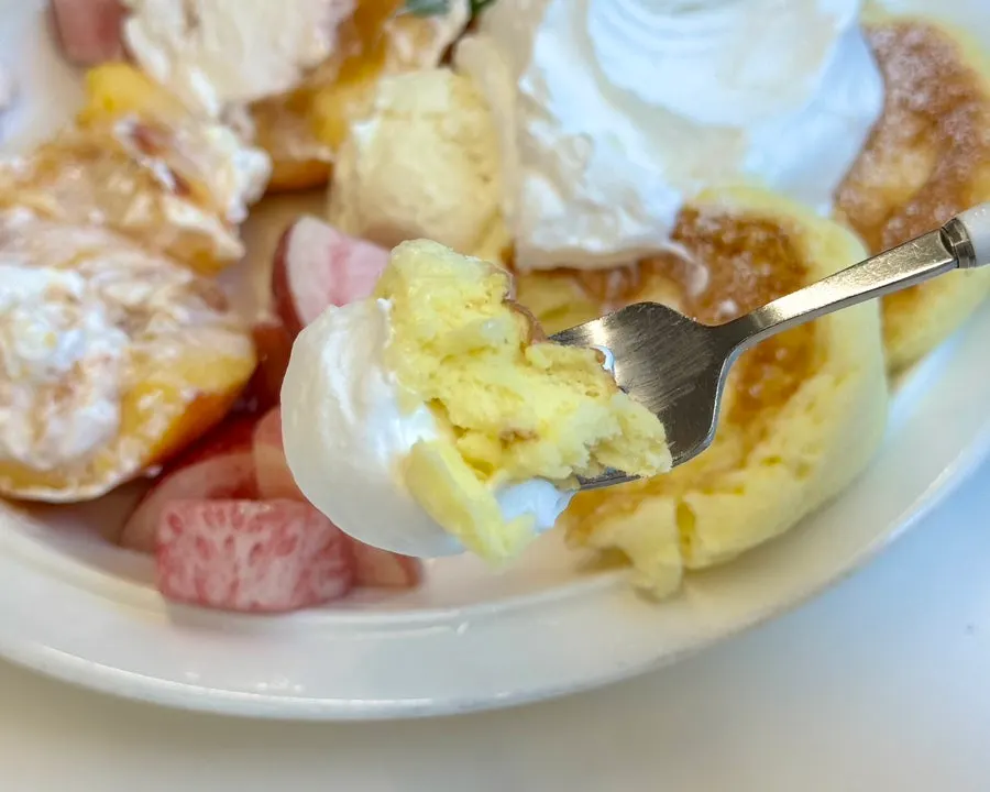Ice cream served alongside the peach soufflé