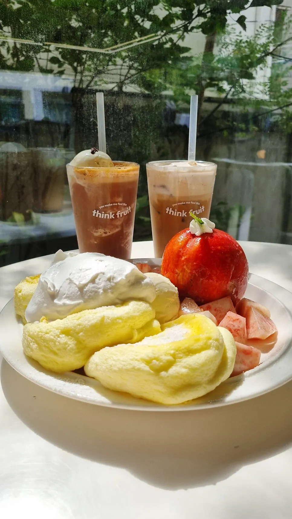 Table spread of peach soufflé and drink set at Think Fruit